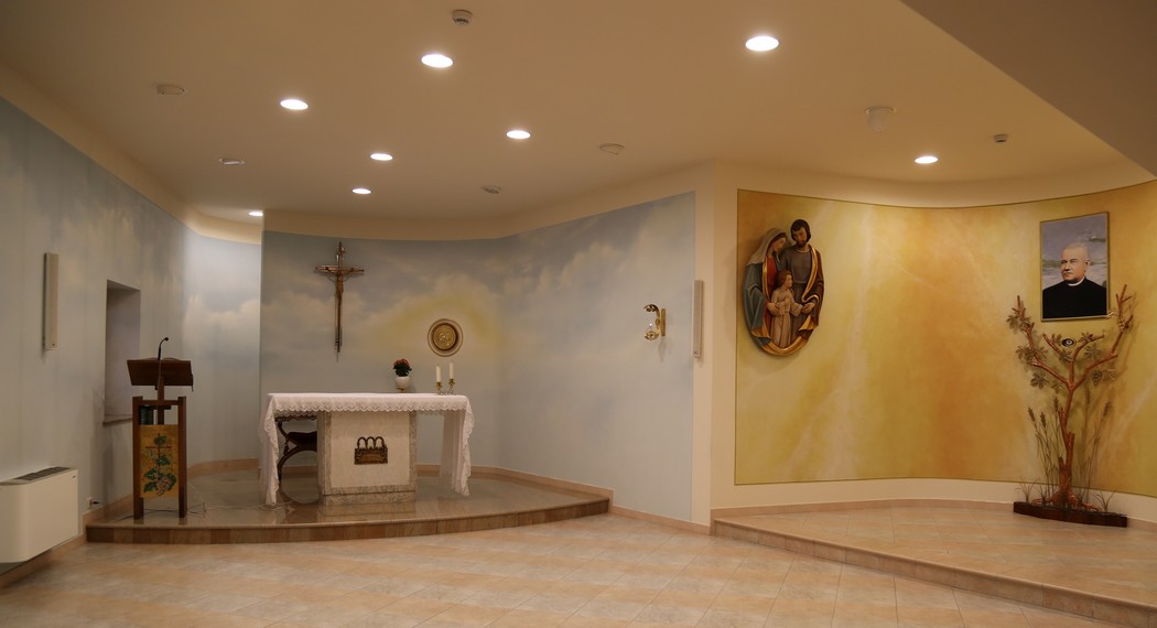 The throbbing center of the complex is the chapel in which one enters to praise God and goes forth  to serve  one's  brothers and sisters.